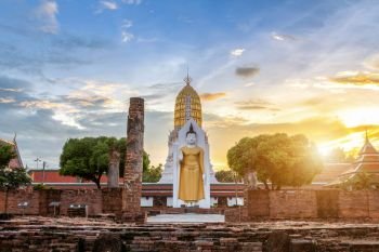 Buddha statue at sunset are Buddhist temple and major tourist attractions at Wat Phra Si Rattana Mahathat also colloquially referred to as Wat Yai is a Buddhist temple (wat) in Phitsanulok,Thailand.