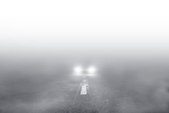 Car driving the Fog Road