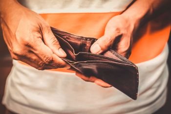 Male's hand holding an empty wallet