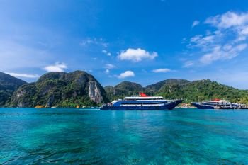 phi phi island kra bi Thailand- December 6,2018 beautiful seascape and tourists on passenger boat high season summer holiday on phi phi island with mountain and blue sky background