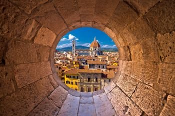 Florence cathedral di Santa Maria del Fiore or Duomo view trhrough stone window, Tuscany region of Italy