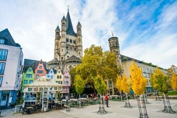 COLOGNE - NOVEMBER 07, 2018 : Colorful houses in front of St. Martin’s church on november 07, 2018 in Cologne