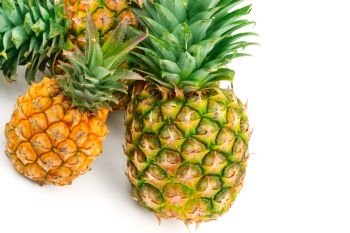 Set of pineapples isolated on white background. Healthy food. Free space for text.