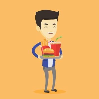 Asian man holding tray with fast food. Young man having a lunch in a fast food restaurant. Happy man with fast food. Unhealthy nutrition concept. Vector flat design illustration. Square layout.. Man holding tray full of fast food.