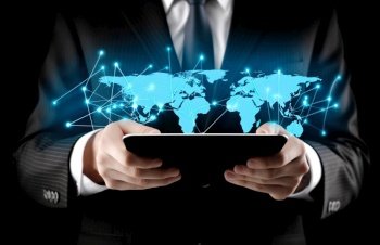 Businessman hands holding tablet with creative glowing world map hologram background. Digital transformation, innovation and future technology concept. Created with generative Ai technology.