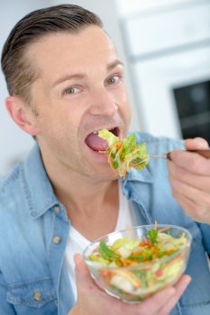 middle aged man eating a healthy meal
