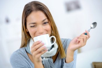 beautiful woman drinking tea at home