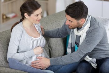 husband and pregnant woman suffing from heart burn
