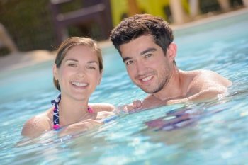 happy couple in the swimming pool