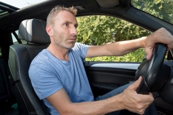 a man driving a car