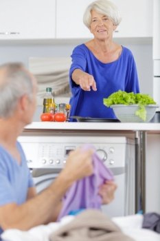 senior man and woman preparing food