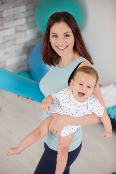 mother and baby doing yoga