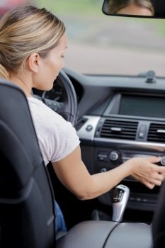 woman sets up car radio