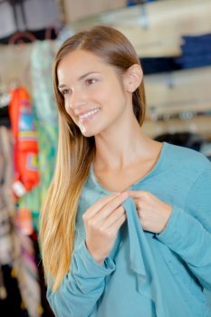 a pretty girl smiling on shop