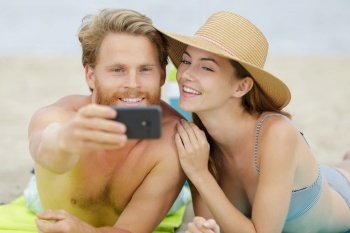 joyful man and woman in making selfie photo