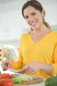 woman preparing a ham sandwich