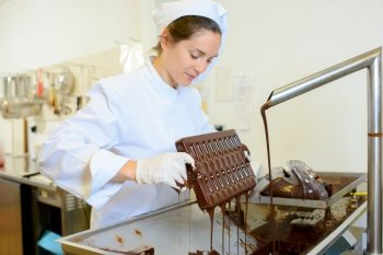 a chef making chocolate mould