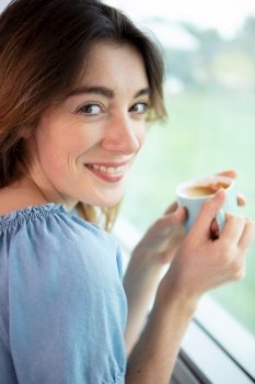 young woman enjoying her morning coffee