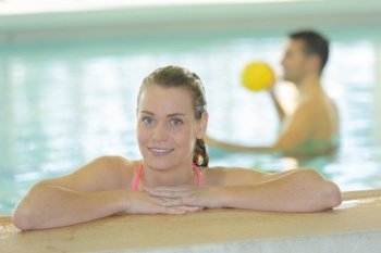 woman in swimming pool smiling