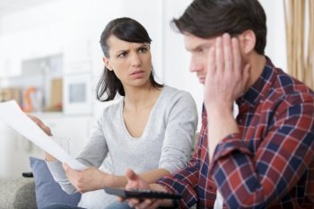 man and woman taking care of financial bills