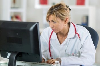 portrait of doctor using a computer