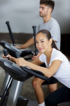 smily woman working out on exerciser