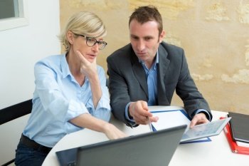 couple having discussion with advisor in office