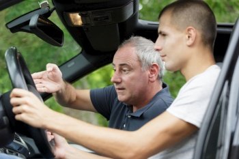 a driving instructor with learner