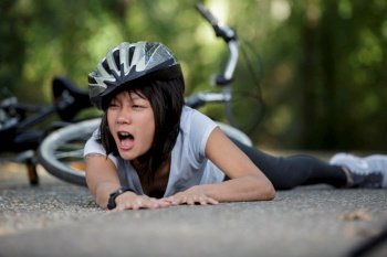 asian woman fallen from her bicycle