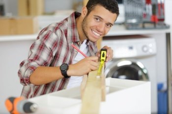 carpenter holding a measure tape