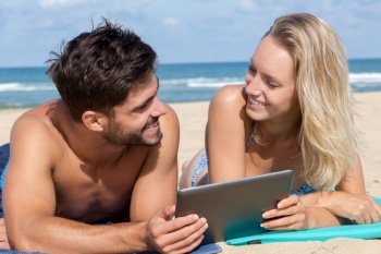trendy man and woman with tablet
