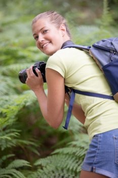 professional woman photographer taking camera outdoor