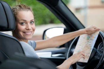 happy woman got lost while driving a car