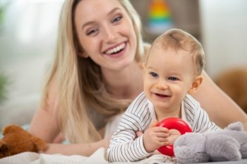 mother and baby at home smiling