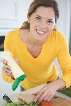 attractive woman making a sandwich