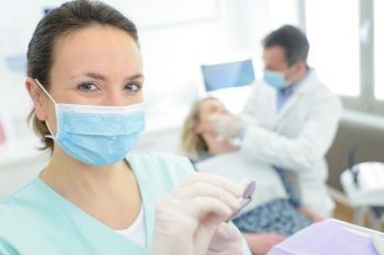 portrait of female dentist smiling in dental clinic