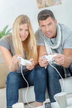 couple at home playing video games