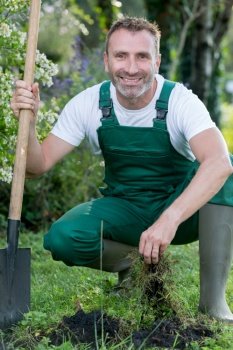 a man gardening and smiling