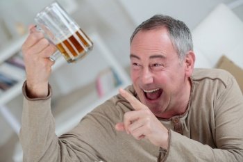 happy drunken man with a glass of beer