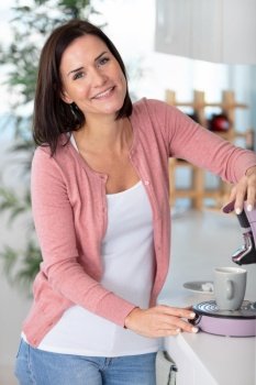 woman making coffee at home