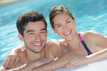 Portrait of attractive couple in pool