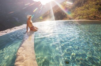 Tourist relaxing in natural thermal pools Las Grutas De Tolantongo in Mexico