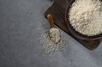 Uncooked Rice in a wooden bowl