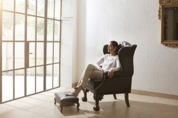 woman sitting and relaxing at home