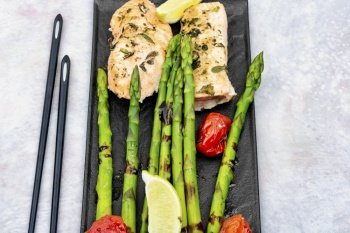Grilled savoury salmon fillet with green asparagus. Healthy meal.. Salmon with asparagus, healthy lunch