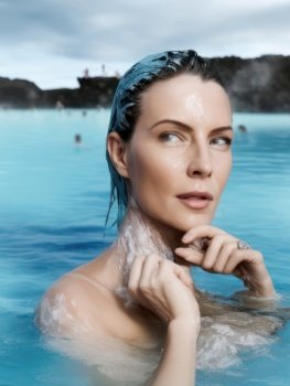 A woman floats peacefully in the crystal-clear blue waters of Iceland’s Blue Lagoon. Surrounded by the stunning natural beauty of the country’s rugged landscape, she basks in the warmth of the geothermal waters and allows the mineral-rich mud to rejuvenate her skin. The sounds of the surrounding wilderness and the peaceful stillness of the lagoon create a serene spa and wellness experience unlike any other. The woman closes her eyes and takes a deep breath, feeling completely relaxed and at peace in this natural haven. She has come to the Blue Lagoon to escape the stresses of everyday life and indulge in a little self-care, and she knows that she will leave feeling refreshed, rejuvenated, and ready to tackle the world once again. AI generative illustration