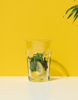 Transparent glass with ingredients for lemonade