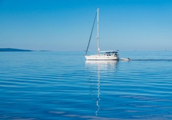 Yacht sailing across completely calm Lake Champlain from Vermont. Yacht sailing peacefully across Lake Champlain