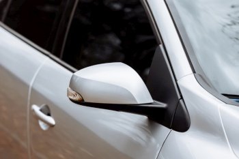 gray side mirror of the car with turn signal repeaters. Exterior new car. side mirror of the car with turn signal repeaters. Exterior new car. gray side mirror of the car with turn signal repeaters. Exterior new car. side mirror of the car with turn signal repeaters. Exterior new car.