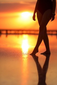 Footage of Beautiful Young Woman in the Swimsuit Walking on the Beach towards the Sea. Girl is Very Slim.. Footage of Beautiful Young Woman in the Swimsuit Walking on the Beach towards the Sea. Girl is Very Slim